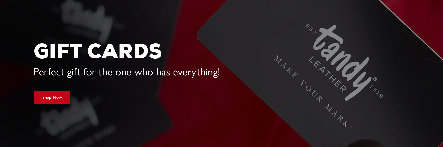 Promotional graphic for Tandy Leather gift cards, showing a black card with white script branding on a dark red background with another blurred card behind it. Gift Cards - Perfect gift for the one who has everything - Shop Now