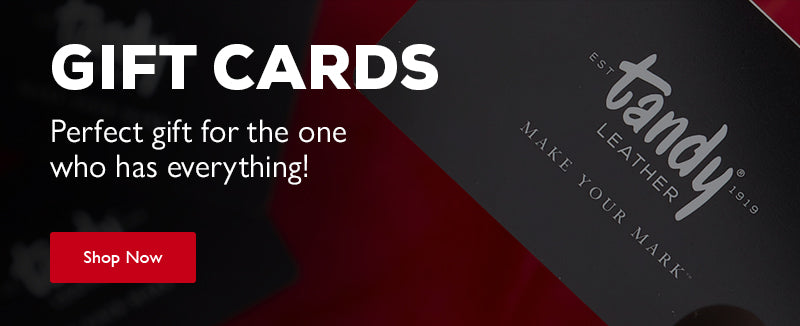Promotional graphic for Tandy Leather gift cards, showing a black card with white script branding on a dark red background with another blurred card behind it. Gift Cards - Perfect gift for the one who has everything - Shop Now